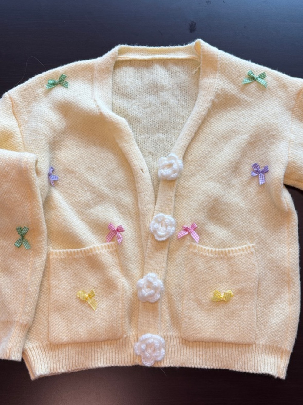 Women’s Pastel Yellow Knit Cardigan with Crochet Flower Buttons and Bow Accents